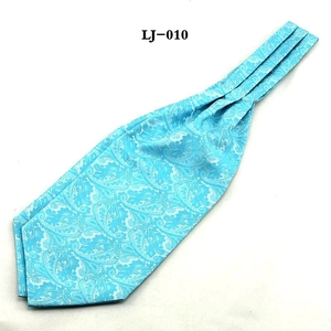 Detail showing light blue paisley jacquard silk ascot tie with pleated texture