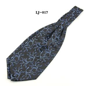 Detail of black and royal blue jacquard floral Ascot tie with silky smooth texture