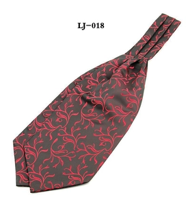 Men's dark grey ascot tie with vibrant red paisley pattern on a white background
