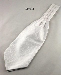 Detailed view of white men's Ascot tie featuring a tonal paisley jacquard pattern