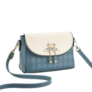 Minimalist crossbody bag for women featuring quilted faux leather and pearl accents