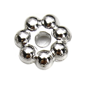 Macro shot of silver flower-shaped CCB spacer beads for DIY jewelry making and bracelets
