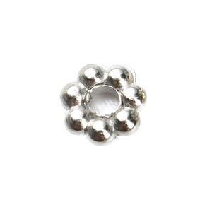 Detailed close-up of a silver flower-shaped spacer bead for jewelry making