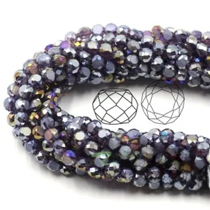 Macro view of faceted purple crystal glass beads with aurora electroplating finish