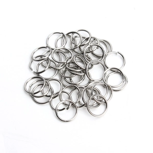 Silver stainless steel open jump rings for DIY jewelry making on white background