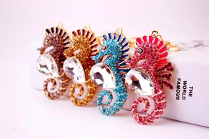 Detailed close-up of seahorse keychains with colorful rhinestones in four vibrant colors