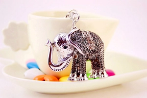 Close-up of sparkling rhinestone-encrusted silver elephant keychain with metal charms