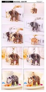 Detail shots of rhinestone-encrusted elephant keychain in gold and silver metal finishes