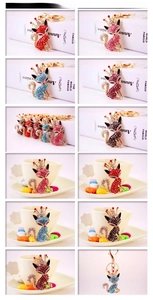 Close-up of rhinestone fox keychains in red, pink, blue, purple and black colors