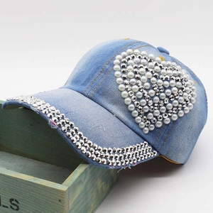 Light blue denim baseball cap with rhinestone heart design and pearl brim details