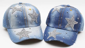Detailed view of washed denim baseball caps with rhinestone star and silver studs