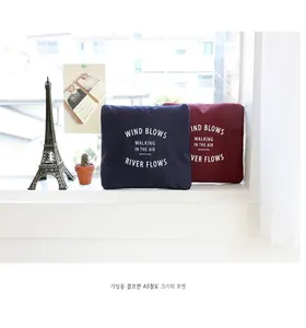 Compact A5 size foldable travel bags in navy blue and burgundy waterproof fabric