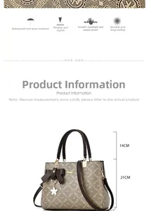 Détails du sac à main montrant une hauteur de 21cm et une anse de 14cm avec texture