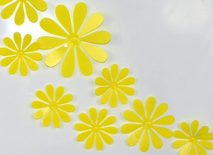 Macro shot of 3D yellow flower wall stickers with glossy finish in various sizes