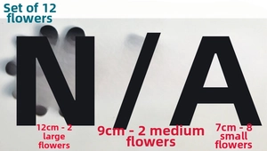 Detailed view of 12-piece black flower PVC wall stickers in three sizes for DIY home decor