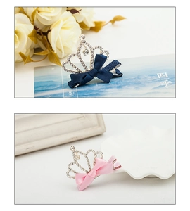 Detail of crystal crown hair clip with ribbon bow for kids, navy and pink versions