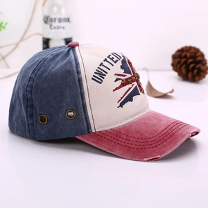 Detail of vintage washed baseball cap with United star embroidery and metal rivet eyelets