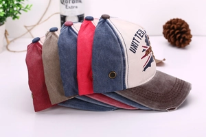 Detail view of multi-color vintage washed cotton baseball caps with distressed embroidery