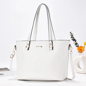 Elegant white leather tote bag with gold hardware, top handles, and adjustable shoulder strap