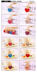 Macro view of rhinestone heart crown keychains in multiple colors with gold plating