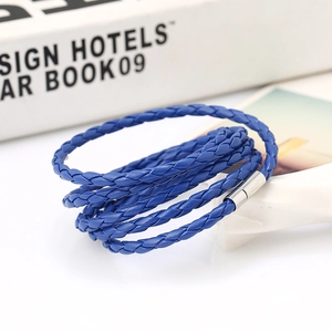Detail of royal blue multilayer braided PU leather bracelet with silver magnetic clasp