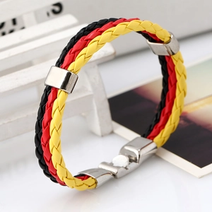 Detail of woven leather bracelet in German flag colors with secure metal clasp