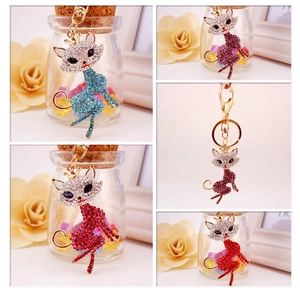 Macro shot of fox keychains with colorful rhinestones in blue, purple and red shades