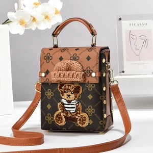 Vintage brown shoulder bag with teddy bear embroidery and gold rivet details