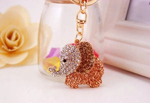 Close-up of sparkling colorful crystal elephant keychain with gold metal clasp detail