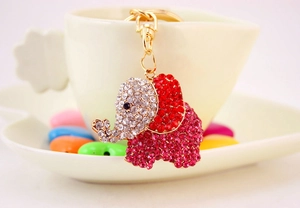 Close-up of cute elephant keychain with vibrant red and white sparkling rhinestones