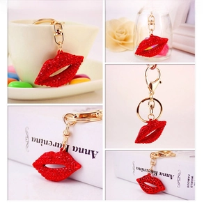Detail showing red rhinestone lips keychain with golden metal ring in multi-angle view
