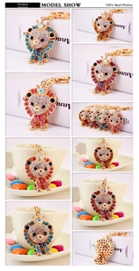 Detail view of colorful rhinestone lion keychains with gold finish and crown detail