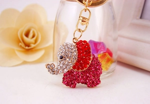 Detail of creative elephant keychain with pink and red sparkling rhinestones