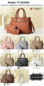 Detailed view of crocodile pattern faux leather handbag set with luxury belt lock buckles