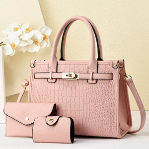 Pink crocodile-embossed handbag set with tote, envelope wallet, and mini pouch