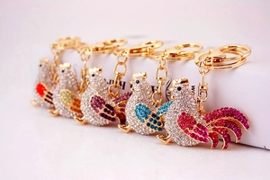Sparkling crystal rooster keychains in five vibrant colors with gold plating