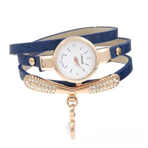 Detail view of navy blue snakeskin leather wrap strap with crystal heart charm