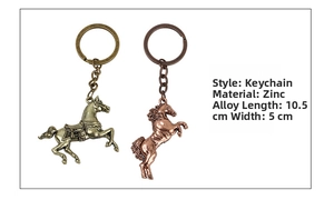Detail view of vintage zinc alloy horse keychains in bronze and red copper finishes