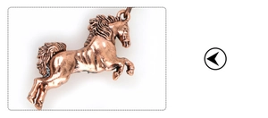 Close-up of a bronze metal horse keychain pendant with detailed metallic texture finish
