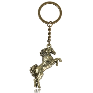 Detailed close-up of antique bronze horse keychain with a robust metal ring and chain