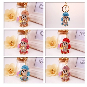 Collage of sparkling crystal rhinestone puppy keychains in six vibrant assorted colors