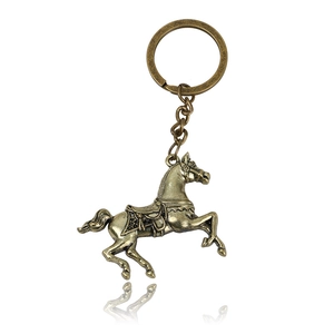 Vintage bronze horse keychain with retro metallic finish and embossed detail on white background