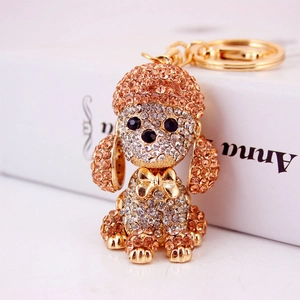 Sparkling crystal dog keychain with champagne rhinestones on a gold metal pendant