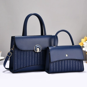Dark blue two-piece tote bag set with V-shaped woven texture and golden metal hardware