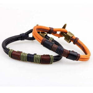 Handcrafted bronze anchor bracelets in black and orange leather with braided rope detail