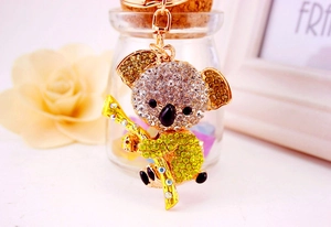Detailed view of koala keychain with silver and yellow crystal rhinestones