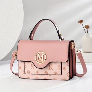 Pink crossbody handbag for women with gold M-buckle and floral AK prints on leather