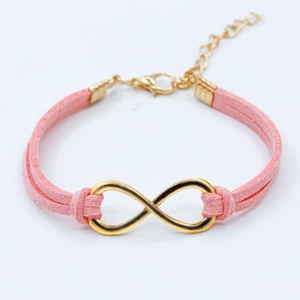 Bracelet cordon en daim rose avec symbole infini doré et fermoir ajustable pratique