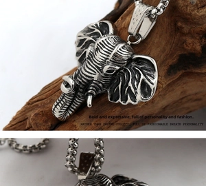 Detail of vintage cast titanium steel elephant pendant with realistic skin texture