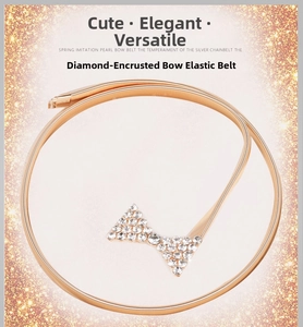 Vue détaillée d'une ceinture à ressort dorée avec une boucle en strass en forme de nœud